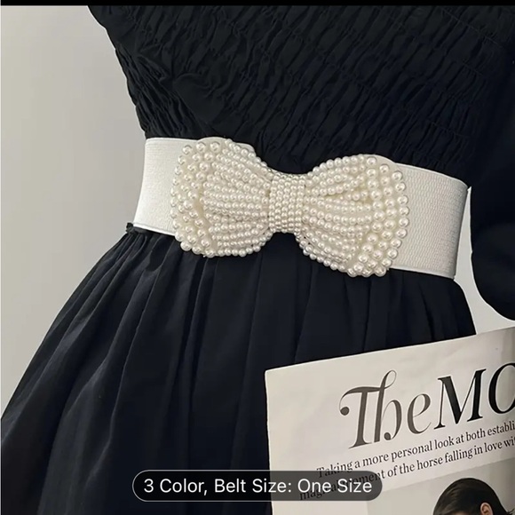 An elegant solid colored elastic waistband with a wide imitation pearl bow - Picture 3 of 10